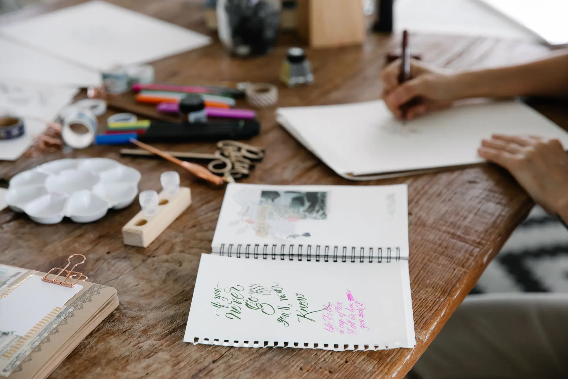 Artisan workshop table with creative tools and materials